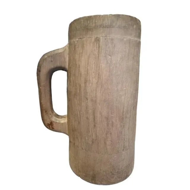 Primitive wooden stein carved from one piece of wood. Use it to hold utensils or art brushes.