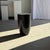 Stool, side table, or coffee table made of solid black cylindrical mango wood. Stool, modular furniture with a geometric...