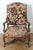 This 19th-century French armchair exemplifies refined craftsmanship and timeless design, showcasing the elegance of Louis...