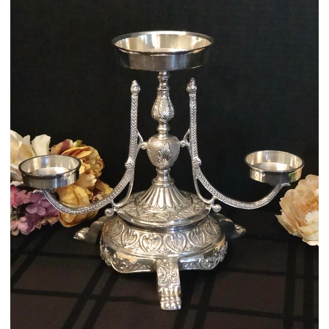 This lovely Silver Plated candle holder piece is from Andrea by Sadek and measures approx.: 10 inches tall x 12 inches...