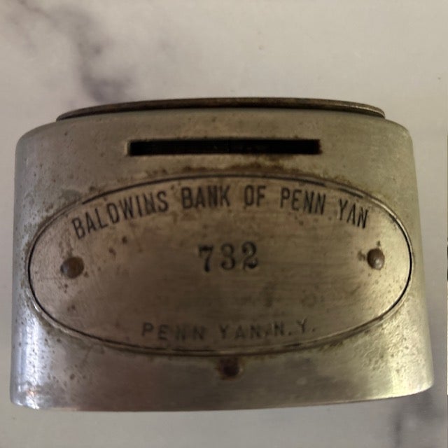 Neat piece of history - an early 20th centruy metal coin bank wtih handle, given away as a premium to a customer of the...