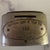 Neat piece of history - an early 20th centruy metal coin bank wtih handle, given away as a premium to a customer of the...