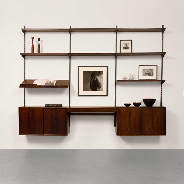 This exquisite vintage FM Reolsystem shelving system, designed by the renowned Danish designer Kai Kristiansen, is a true...