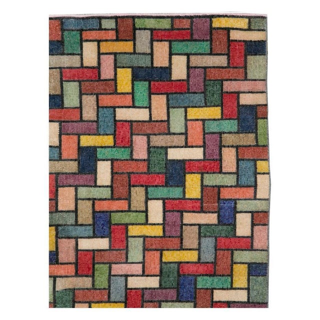 A vintage Turkish Anatolian accent rug handmade during the mid-20th century with a modern and colorful design in jewel...