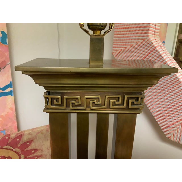 20th century bronzed columned table lamp. Greek key design detail. Solid piece. Base to top of socket measures 25”