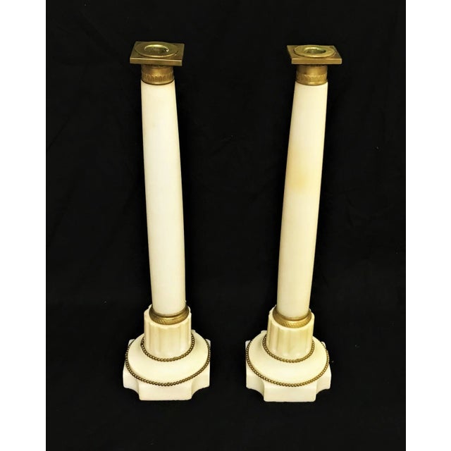 Awesome tall pair of vintage Italian marble candlesticks! This pair is made of an ivory toned marble with very little...