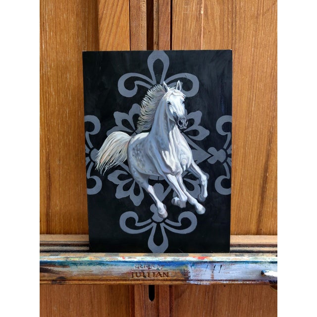 The artwork depicts a majestic white horse in mid-gallop, exuding a sense of dynamism and grace against a stark black...