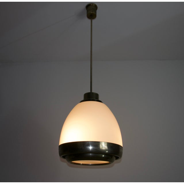 This elegant Italian ceiling lamp by Pia Guidetti Crippa for Lumi from the 1960s is a stunning example of mid-century...