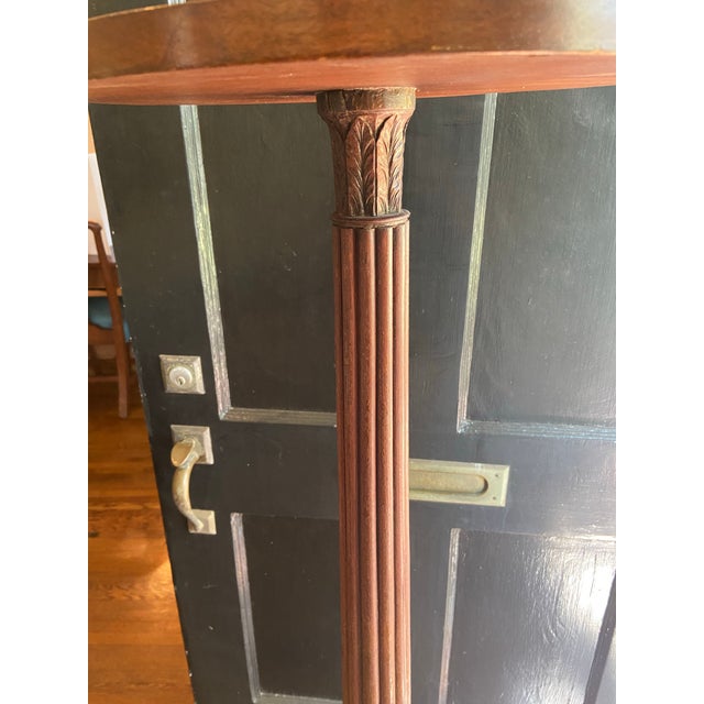 Antique, English mahogany plant /fern stand with graceful fluted support with carved leaves. Tripod base and slipper feet