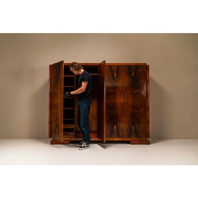 Art Deco wardrobe in pallisander wood by 't Woonhuys.It's impossible not to notice this wardrobe when you walk into the...