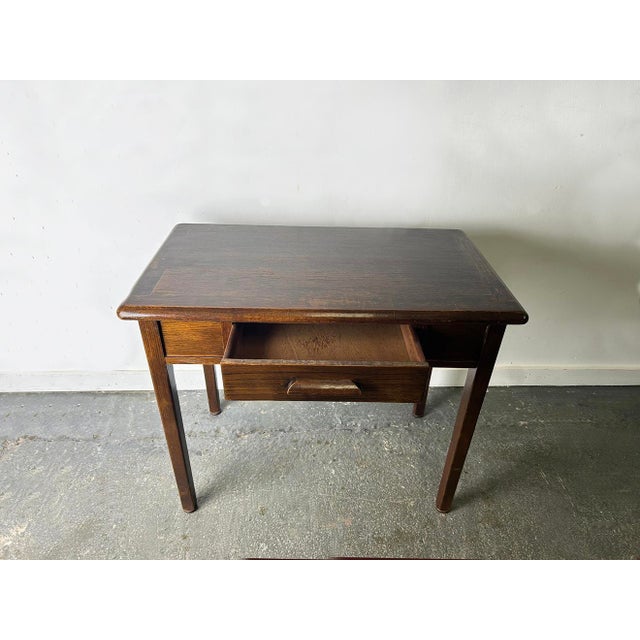 A compact, well-made single drawer desk or writing table by Abbess Office Equipment in dark stained oak. Circa 1950s–60s....