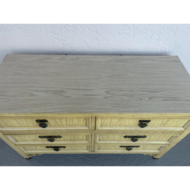 Dixie Shangri La 6 Draw Dresser finished in yellow with brass handles. Elegant style Asian themed lots of storage