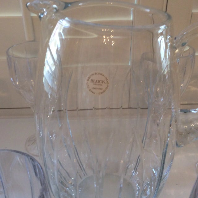 This set is very unique, mouth blown, hand cut and polished by hand. The eight Crystal goblets and pitcher are lead free....