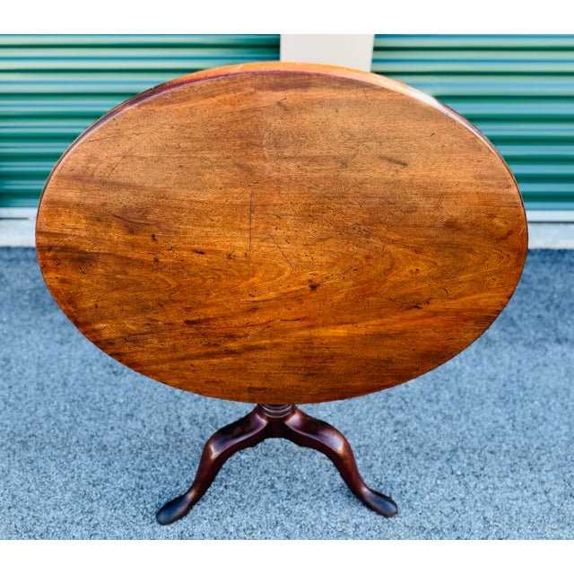 Early 19th C. Mahogany Tilt-Top Single Board Candlestand. This hand made English table has a single board top that can be...