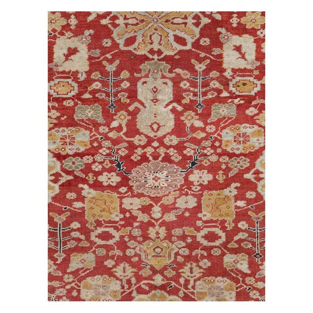 An antique Persian Sultanabad long and narrow rustic carpet in gallery format handmade during the early 20th century with...