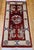 This striking vintage Chinese area rug from the third quarter of the 20th century reflects the bold aesthetic and symbolic...