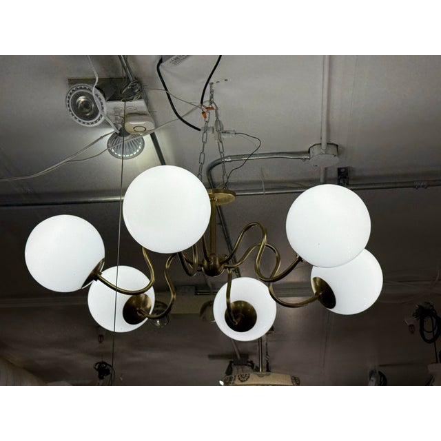 Design Plus Gallery presents a Tillie Chandelier by Magnolia. This art nouveau and mid-century Italian inspired chandelier...