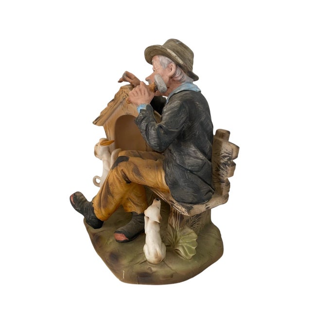 This vintage Lefton Japan figurine features an old man dog sitting on a bench, hand-painted with exquisite detail. This...
