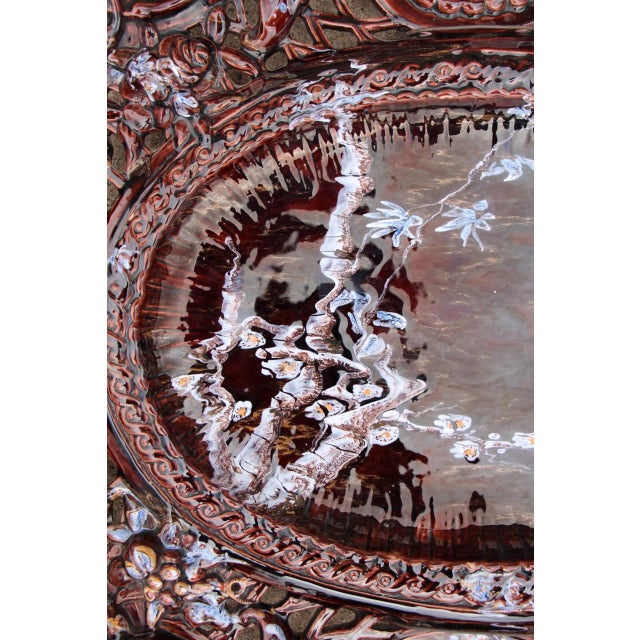 Large Saint-Clément faience platter, from the period when Émile Gallé was artistic director. Superb in its size and...