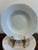 A timeless set of vintage Hutschenreuther Bavaria white porcelain soup bowls featuring softly sculpted decorative rims and...