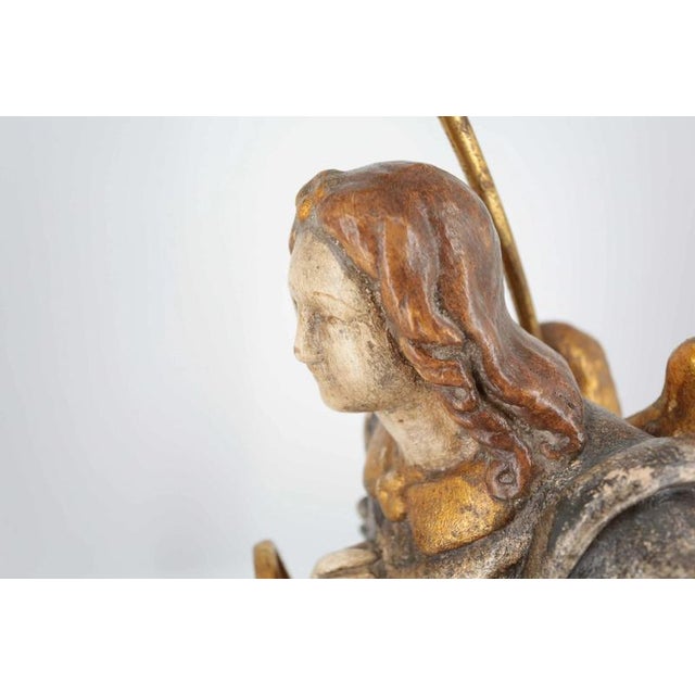 Beautiful terracotta statue of an angel decorated with polychromy. Top shade made of brocade fabric. The lamp is heavy and...