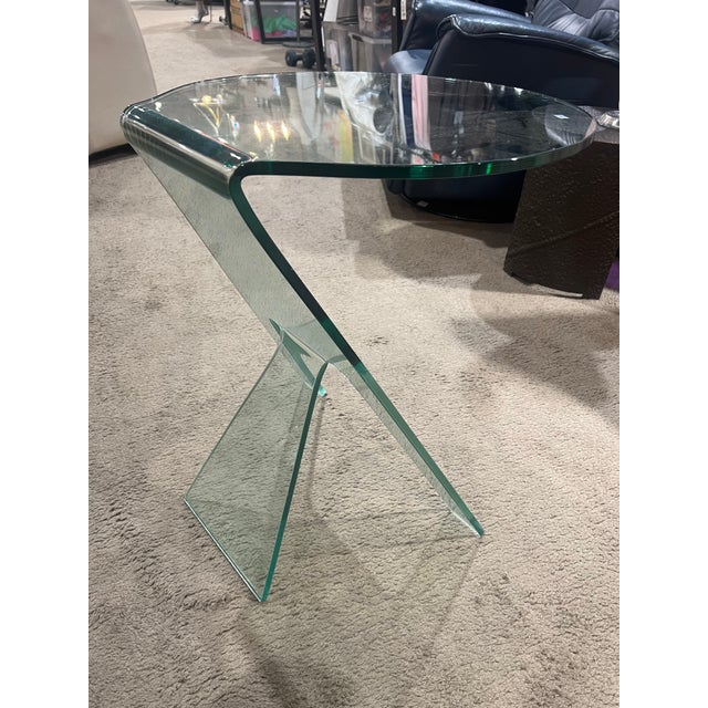 Sleek, sculptural, and effortlessly modern, the Grillo “Journey” Clear Glass Side Table is a striking example of...
