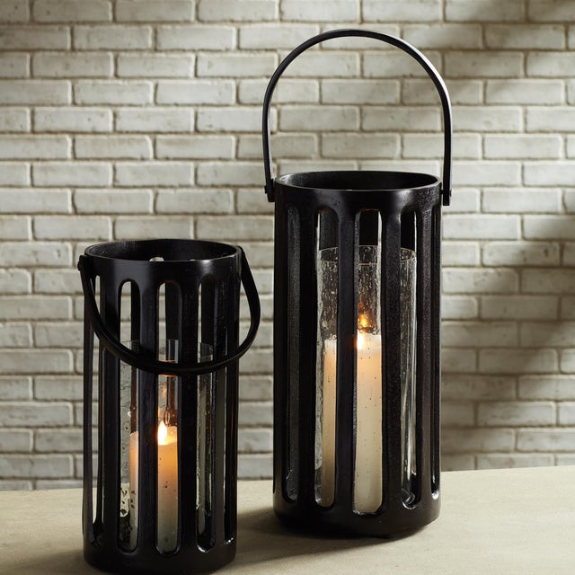 This cast aluminum hurricane has a great presence. Strong and sturdy, it makes a solid accent. The seeded glass insert, it...