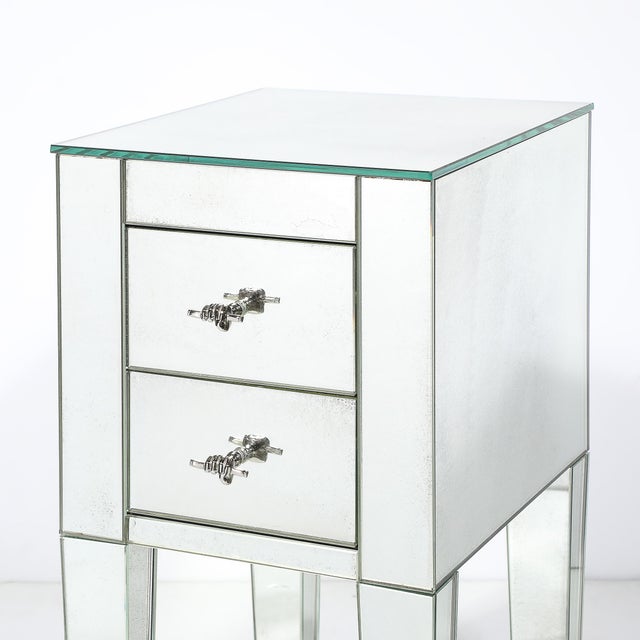 This Modernist mirrored end table or nightstand is a striking piece that seamlessly blends form and function with a nod to...