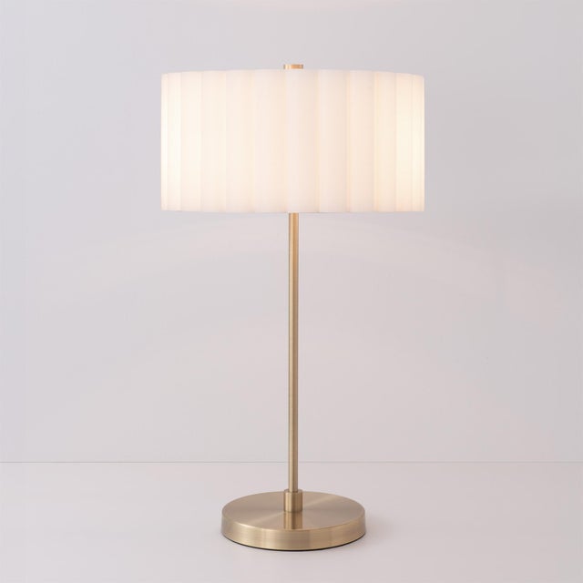 Crafted with weathered brass steel and a sleek silhouette, the Slimline Table Lamp is a modern table lamp ideal for...
