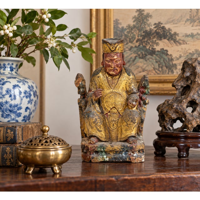 Antique Chinese Qing Dynasty carved wood Daoist temple deity or divine official, richly decorated with gilt lacquer and...
