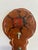A delightful vintage folk art wall hook rack featuring a hand-painted red ladybug on a warm-toned wooden plaque with...