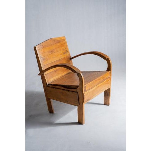 Small Asian armchair in upcycled wooden slats. Rounded handles, comfortable. The irregularities of the wood and...