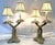 Great pair of vintage Palm Beach Chic table lamps from the late 20th century. Each has a double crossed palm tree design...