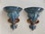 Offered is a stunning pair of vintage ceramic architectural wall brackets. These showcase a prominent central fleur-de-lis...