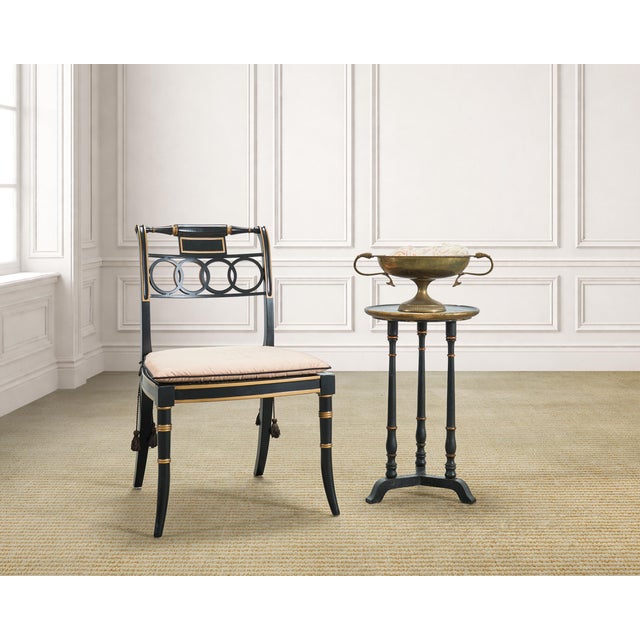 A charming side or drinks table crafted in an English Regency style with Chinoiserie decoration. Intentionally distressed...