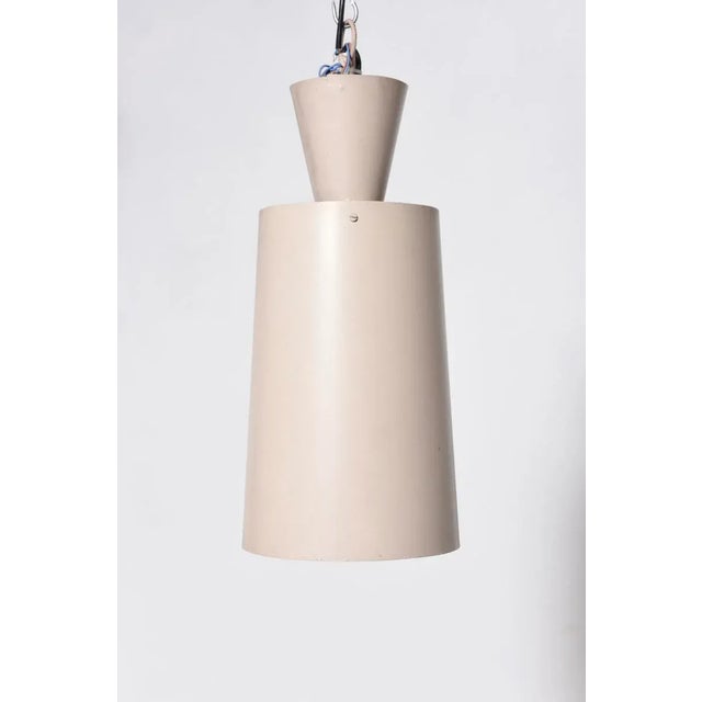 This grey enameled metal light with uplighting was manufactured by Philips in 1959. This piece is attributed to the...