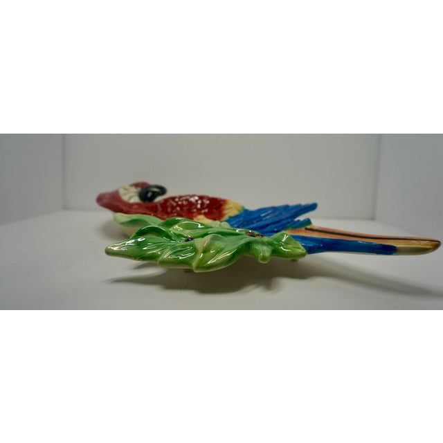 Bring a bold splash of Tropical Maximalism to your next gathering with this striking vintage ceramic parrot serving dish....