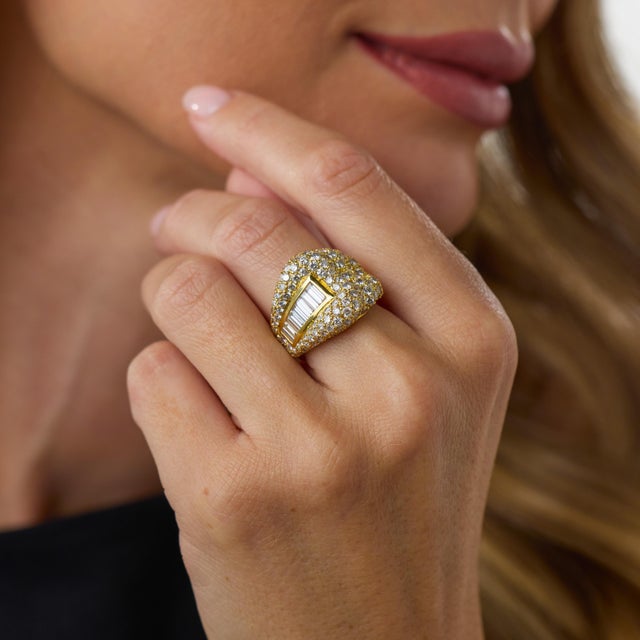 This striking vintage diamond cocktail ring is a glamorous 1980’s design, crafted in rich 18k yellow gold and set with 145...
