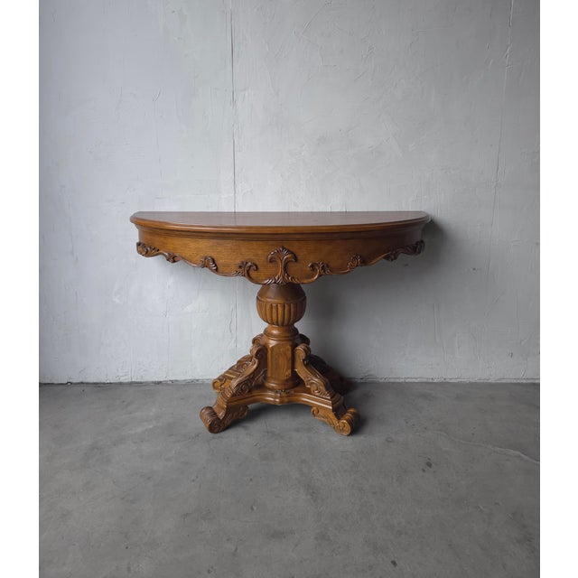This carved oak demi lune console table is a beautiful example of Renaissance Revival Style furniture. Beautiful warm,...