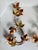 Dating to the mid-20th century, this elegant pair of Curtis Jere-style tole wall sculptures features gracefully scrolling...