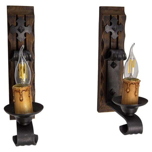 Midcentury pair of wall lights french made circa 1960. Pine and wrought iron. These are suitable to usa and eu or uk...