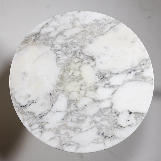 Pair of coffee tables by Eero Saarinen with a white tulip shaped base and round marble top.