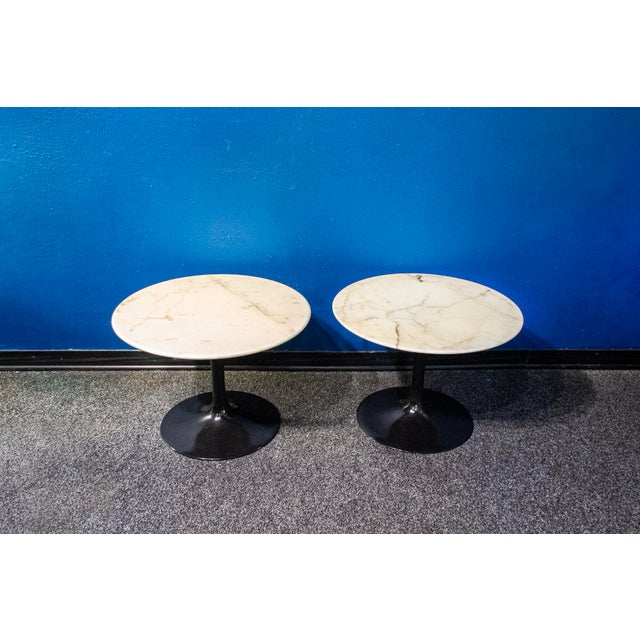 Pair of coffee tables with aluminum structure and marble top. Tulip model Designer Eero Saarinen Manufacturer Knoll...
