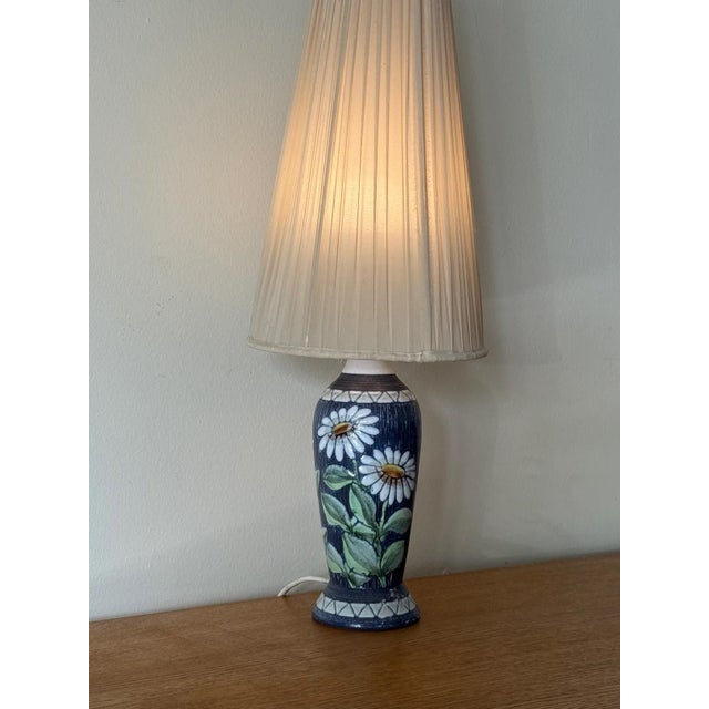 Has been reworked to US plug. In overall excellent condition, some wear to the shade slight tears and staining shown in...