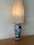 Has been reworked to US plug. In overall excellent condition, some wear to the shade slight tears and staining shown in...