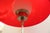 Italian Modernist floor lamp. Red plastic shade merged with metal decorative elements and interior frosted glass globe....