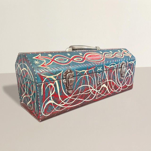 This is what happens when a toolbox decides it would rather be art. An American 1960s turquoise green metal toolbox...