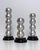 Vintage circa 1990s postmodern design stacked ball silver leaf and black lacquered candle taper holders. Sculptural,...