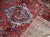 Handmade antique Sarouk rug in red color. The rug is from the beginning of 20th century in original good condition....