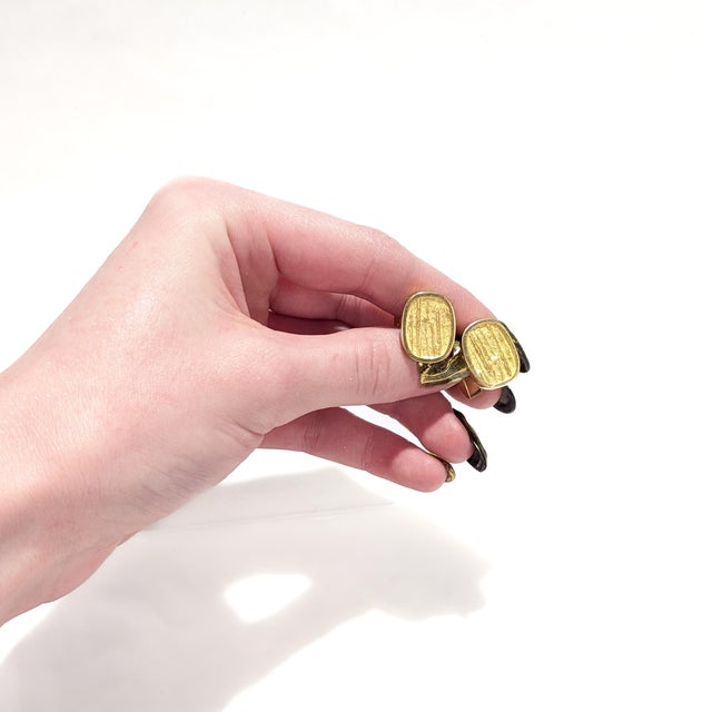 A fine pair of Danish Modern gold cufflinks. By Georg Jensen. In 18 karat yellow gold. Model no. 893. Each with heads that...